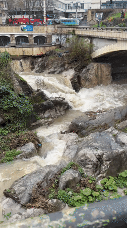 Muddy river rapids captured flowing through Gabrovo, Bulgaria