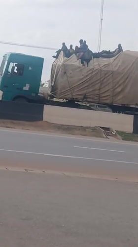 Passenger trucks observed on Nigerian highway near Hayin Banki