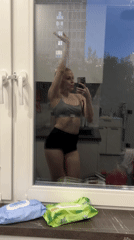 Woman Takes Mirror Selfie in Kitchen, Khimki Russia