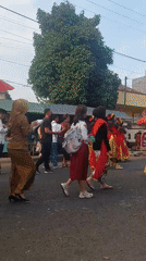 Traditional street procession rolls through Jogoyudan with decorated float