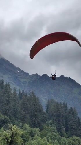 Solang Valley's full tourist spread: paragliders, yaks, camels, and gondolas