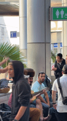Group in religious attire moves through Israeli airport terminal