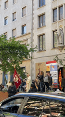Priest conducts outdoor religious service in Barcelona square
