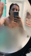 Woman records mirror selfie video after shower