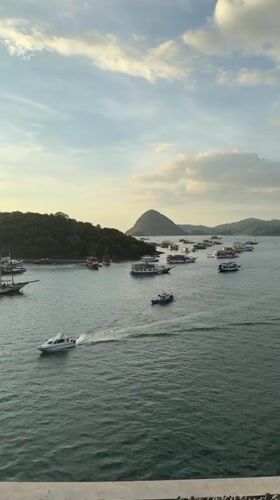 Harbor activity documented in Labuan Bajo, Indonesia morning scene