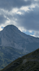 Sheep, peaks, and winding roads in Montenegro's highlands