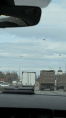 Morning traffic captured from car windshield in Moscow