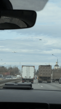 Morning traffic captured from car windshield in Moscow