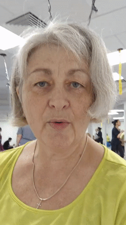 Woman leads exercise class with blue balls in Krasnodar gym