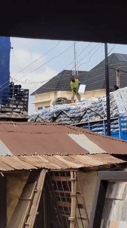 Two men spotted atop loaded truck in Maiburiji, Nigeria