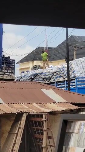 Two men spotted atop loaded truck in Maiburiji, Nigeria