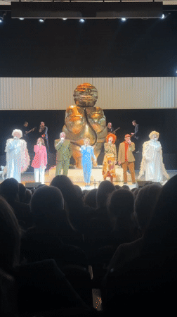 Costumed singers perform with live band in Riga