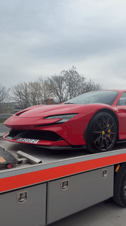 Red Ferrari towed through Plovdiv, Bulgaria