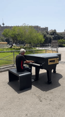Outdoor grand piano session on the streets of Barcelona