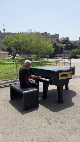 Outdoor grand piano session on the streets of Barcelona