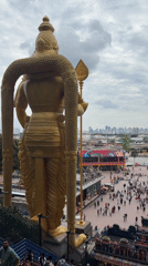 Visitors document morning activities at Malaysia's Batu Caves temple complex