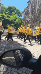 Morning street scenes captured in Plovdiv featuring marching band