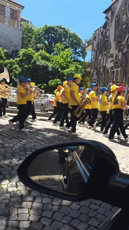 Morning street scenes captured in Plovdiv featuring marching band