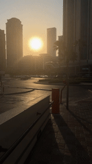 Dubai street at golden hour, bags in hand