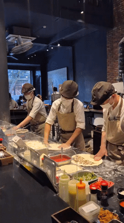 Morning rush at wood-fired pizzeria in Đà Nẵng