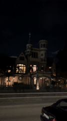 Historic Mille Fleurs mansion photographed at night in Port of Spain