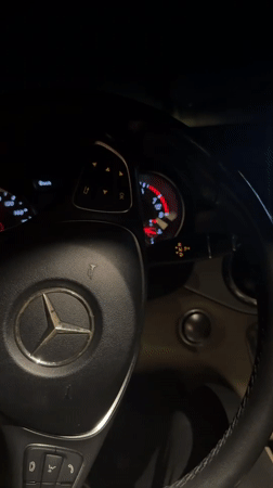 Cars parked with hazard lights flashing in Blagoevgrad at night