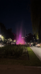 Colorful fountain lights up a Bishkek park on a summer evening
