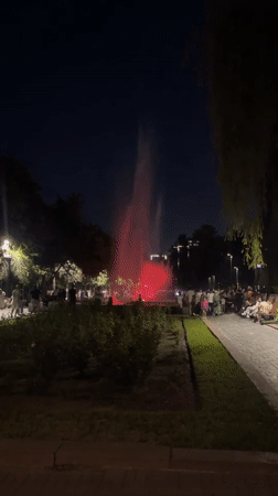 Colorful fountain lights up a Bishkek park on a summer evening