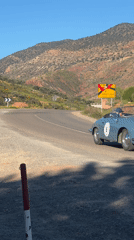Vintage blue convertible spotted on rural Moroccan mountain roads