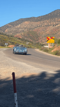Vintage blue convertible spotted on rural Moroccan mountain roads