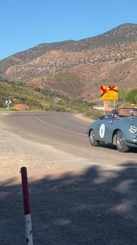 Vintage blue convertible spotted on rural Moroccan mountain roads