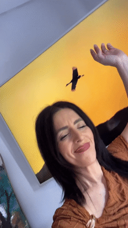 Hairless cat in striped shirt observed indoors in Konz