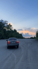 Evening vehicle gathering in industrial area near Perm