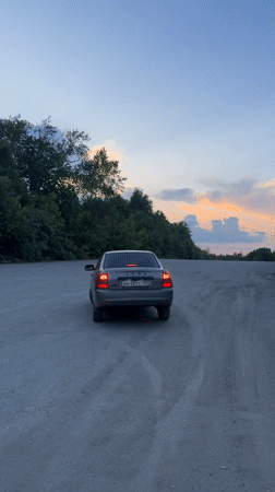 Evening vehicle gathering in industrial area near Perm