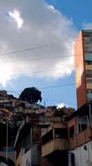 Street-level look at a Caracas hillside neighborhood and surroundings