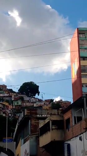 Street-level look at a Caracas hillside neighborhood and surroundings