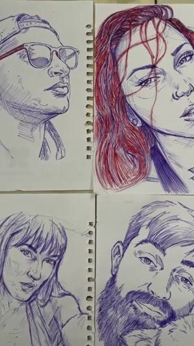 Pen-and-ink portrait sketches laid out on a tiled floor in Abuja