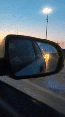 Evening drive through Chaikovsky captures sunset over water
