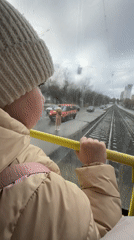 Child rides tram through rainy Izhevsk streets