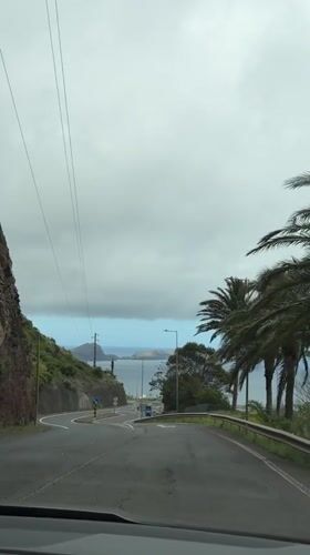 Coastal road traffic captured in Machico, Portugal