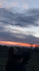 Woman plays with child in Russian village