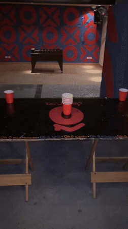 Woman spreads cards at table in São Paulo evening