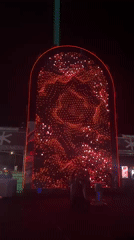 Illuminated outdoor stage with LED displays observed in Fano