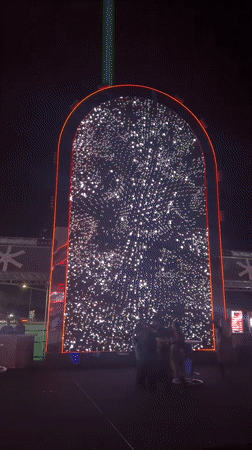 Illuminated outdoor stage with LED displays observed in Fano
