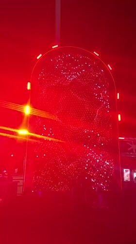 Illuminated outdoor stage with LED displays observed in Fano