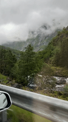 Rainy mountain drive through tunnels and winding scenic roads