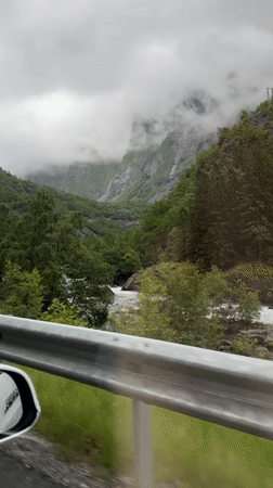 Rainy mountain drive through tunnels and winding scenic roads