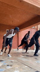Young men perform synchronized dance routine in Vom, Nigeria