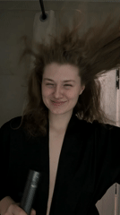 Woman captured mid-hair styling routine in Kazan