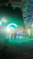 Night carnival operates with illuminated rides in Rastatt, Germany